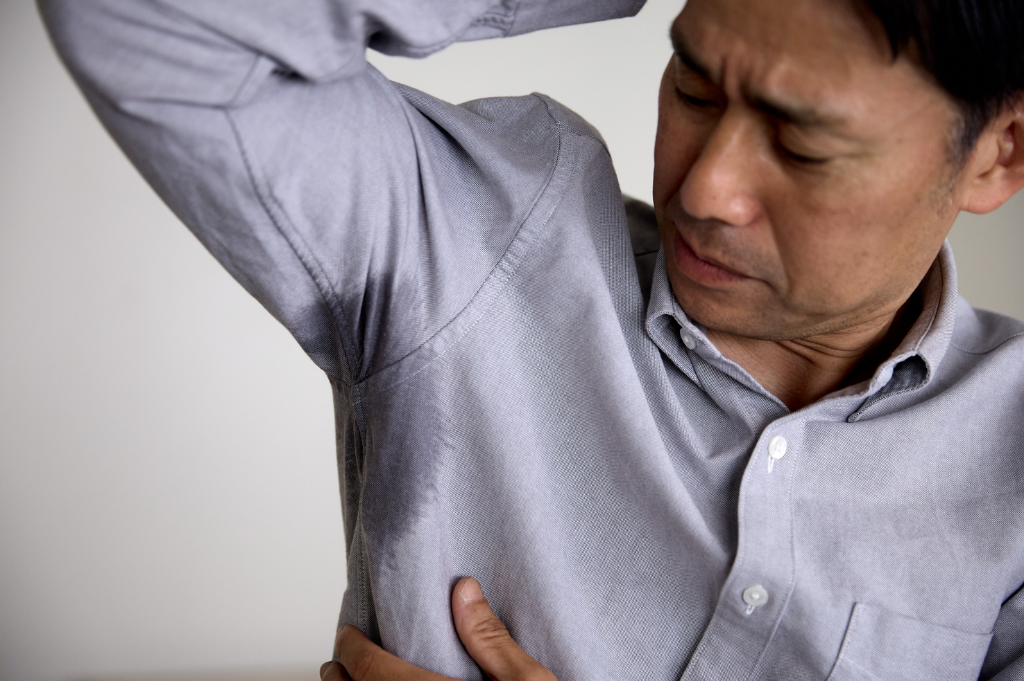 Why Do Sweat Stains Smell So Bad — Even After Washing?